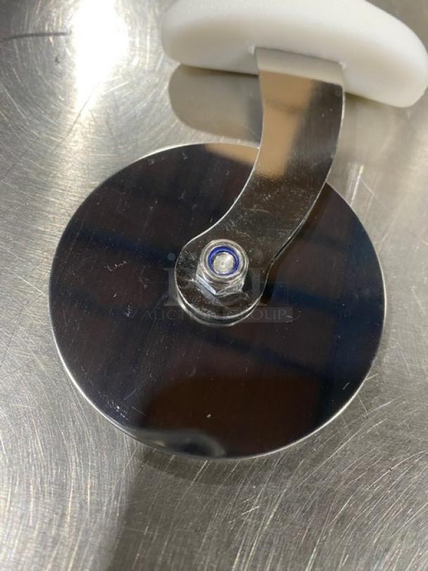 Commercial stainless steel pizza cutter, model PCP-2, with a white grip handle. New condition, 2-inch blade.