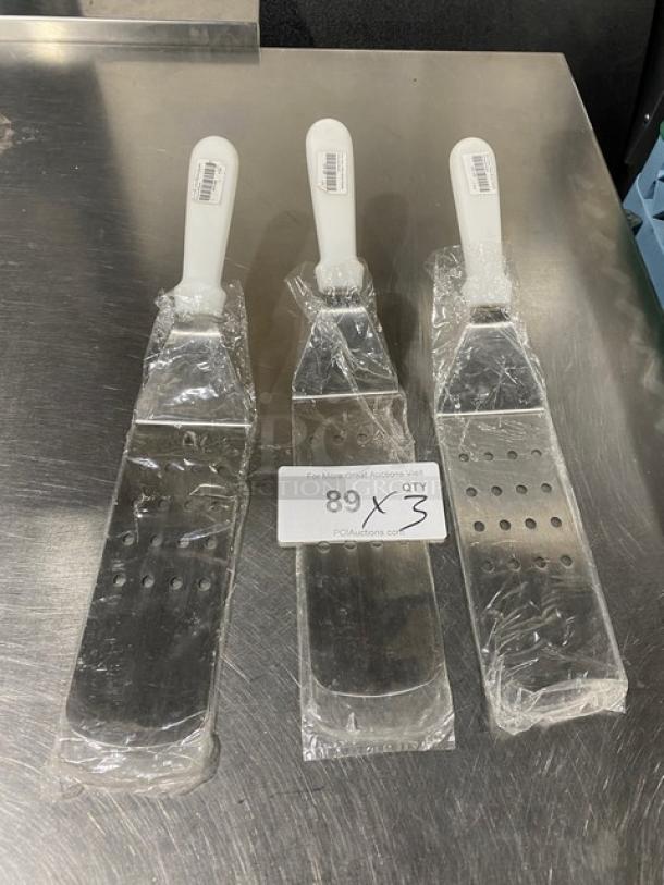 NEW Commercial Stainless Steel Perforated Flex Turner, Model PFT10P, with white grip handle, new condition, set of 3.