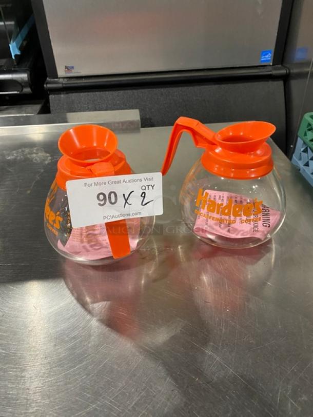 NEW Duran Hardee's glass coffee decanters with orange handles, decaffeinated style, set of two, commercial use, clear markings.