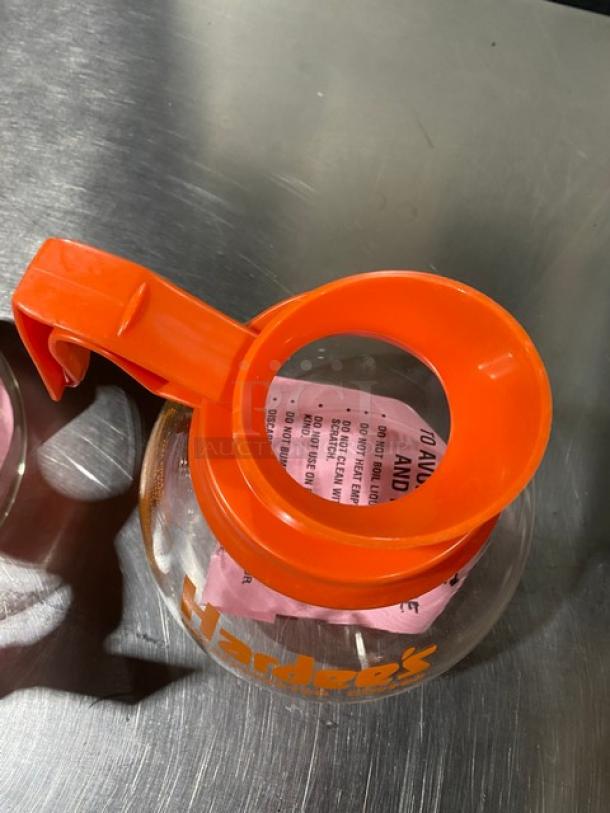 NEW Duran Hardee's decaffeinated style glass coffee decanter, orange handle, commercial use, clear labeling, excellent condition.