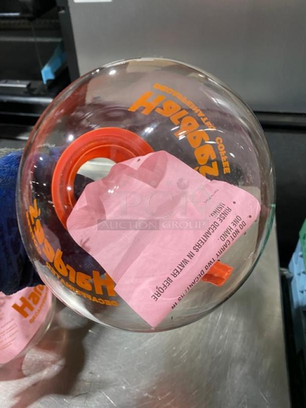 NEW Duran Hardee's glass coffee decanter with orange handle, labeled "Decaffeinated," in excellent condition.