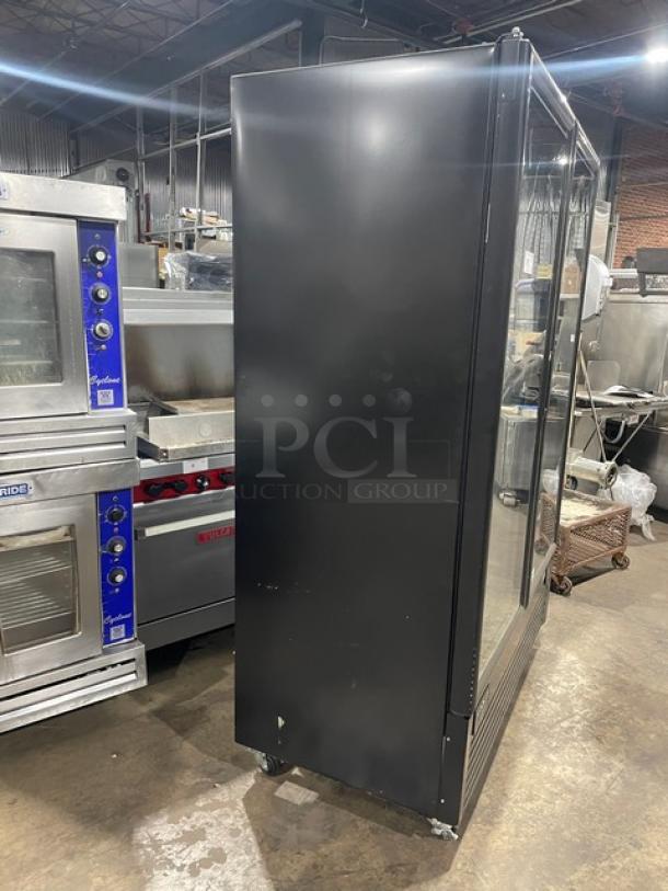 Kool-It Commercial Black Electric Double Glass Door Merchandiser Freezer, Model 163LX46FB, on casters, with poly-coated racks.