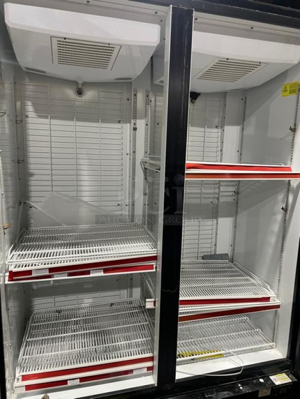 Kool-It black electric double glass door merchandiser freezer, model 163LX46FB, with poly-coated wired racks on casters.