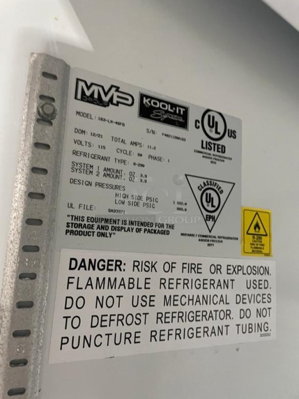 Kool-It electric double glass door freezer, model 163-LX-46FB, features poly coated wired racks, 115V, on casters.