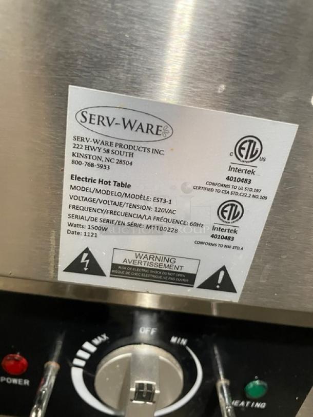 Serv-Ware commercial stainless steel hot food table, model EST3-1, with label showing serial number M1100228, 120V.