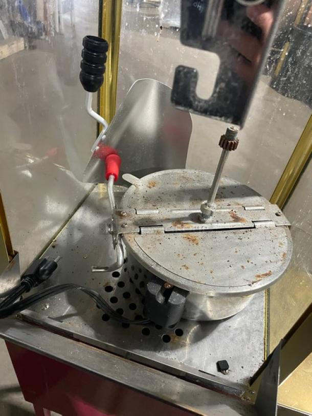 Great Northern Popcorn commercial pink electric popcorn machine, showing interior kettle and mechanism. Used condition.