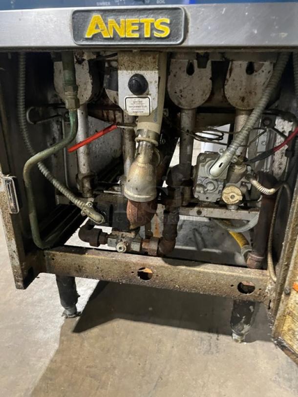 Anets GPC18 stainless steel pasta cooker, natural gas powered, with backsplash, on legs, shown in used condition.