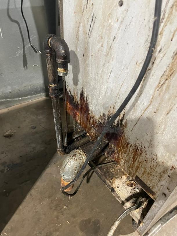 Anets GPC18 Commercial Stainless Steel Pasta Cooker, natural gas powered, with back splash. Visible wear and rust on pipes.