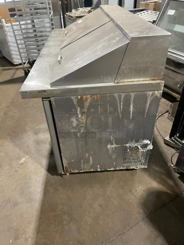 Atosa Mega Top Series 3-door refrigerated prep table, model MSF8308GR, stainless steel, on casters, visible wear.