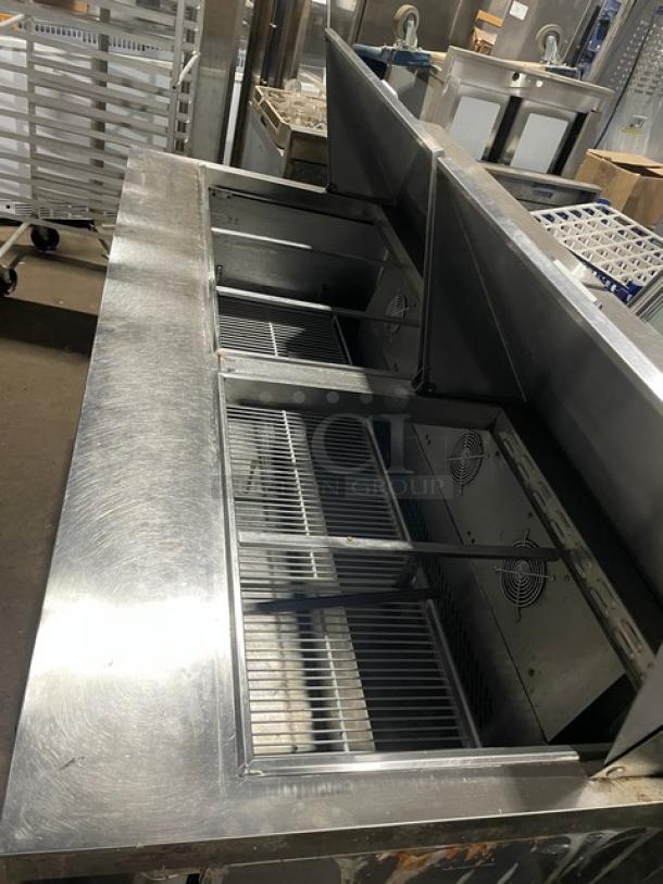 Atosa Mega Top Series 3-door stainless steel prep table, Model MSF8308GR, refrigerated, on casters, electric-powered.