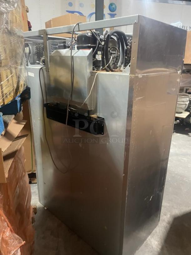 Turbo Air M3 Series stainless steel 2-door freezer, model M3F472, in used condition, showing back view and components.