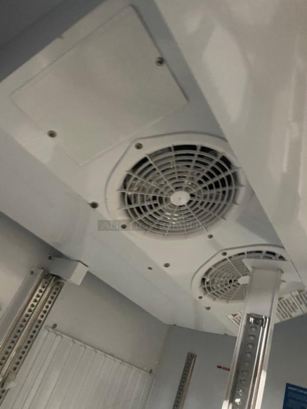 Turbo Air TGF-47SDB-N interior with fans, poly coated wired racks, black exterior; commercial glass 2-door freezer merchandiser.