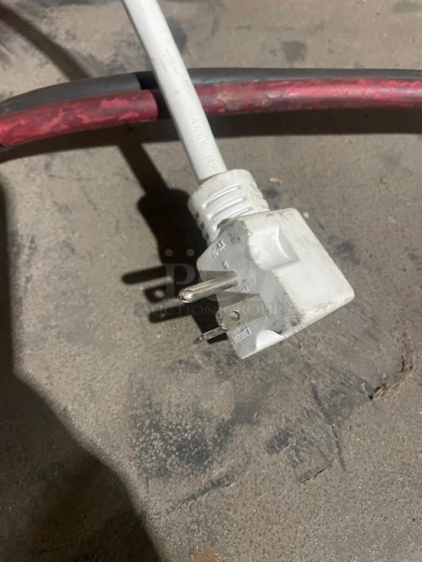 Close-up of a three-prong power plug for the Turbo Air TGF-47SDB-N commercial freezer.