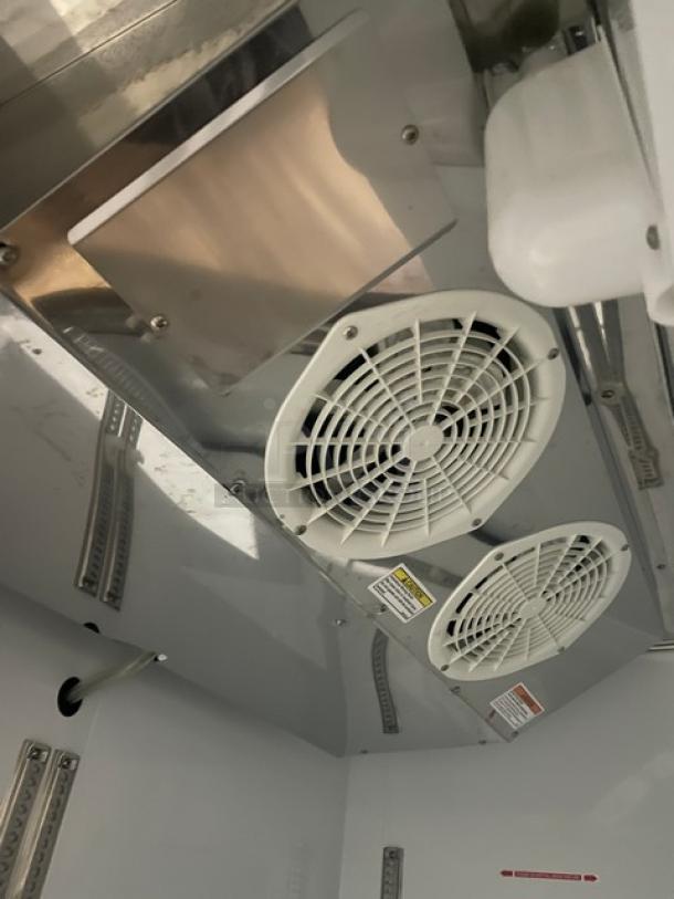 Beverage-Air stainless steel 2-door reach-in freezer interior, model KF48-1AS, features poly coated wired racks, electric-powered, 115V.