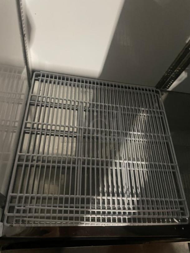 Beverage-Air KF48-1AS commercial freezer interior showing poly coated wire rack, stainless steel build, mint condition.