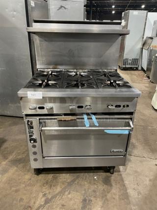 Jade 6-burner natural gas range with stainless steel finish, convection oven, raised backsplash, salamander shelf, on casters.