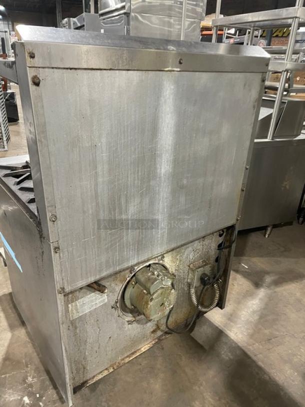 Jade Range natural gas 6-burner with stainless steel build, full-size convection oven, raised back splash, and salamander shelf. On casters. Used condition.