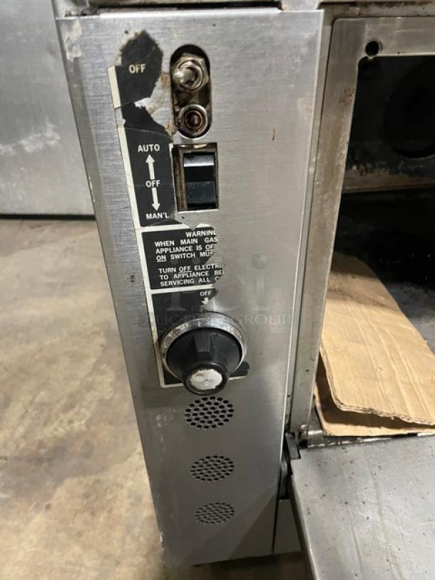 Jade Range control panel with knob and switch, stainless steel finish, label detailing operation instructions is visible.