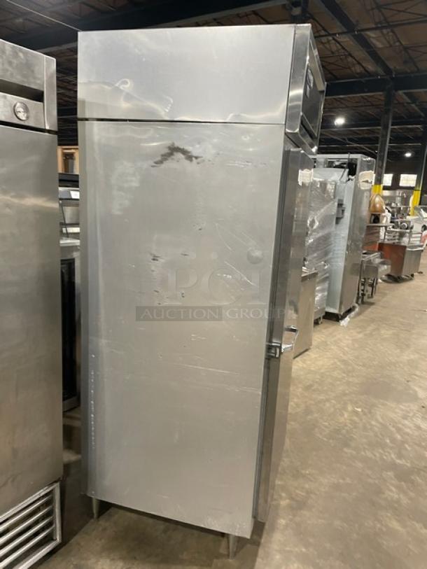 Continental one-door reach-in freezer, model DL1FE, stainless steel, on legs. Serial 13548061, 115V, 1 phase. Visible surface scratches.