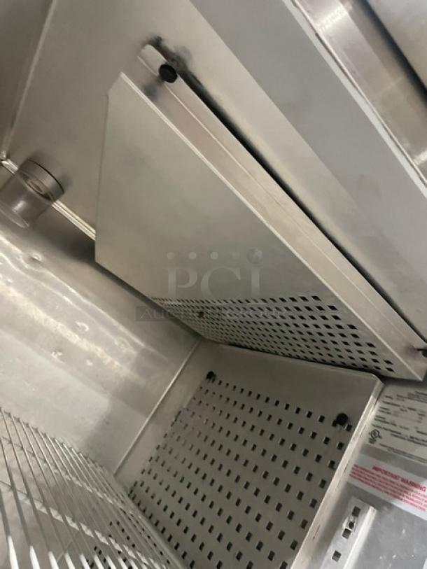 Continental DL1FE one-door reach-in freezer, all stainless steel, 115V, 1 phase, on legs. Interior view, clean condition.