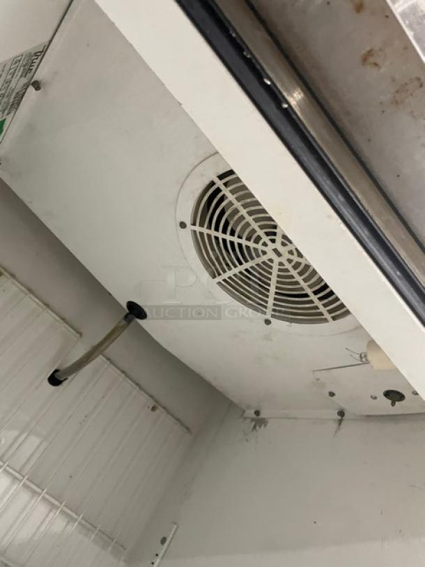 True T23F One Door Reach-In Freezer interior showing fan and shelving. Used condition, 115V, 1 Phase, Serial 13209831.