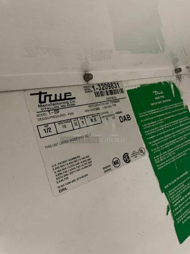 True one-door reach-in freezer, Model T23F, Serial 13209831, 115V, 1 Phase. Label shows specs and regulatory markings.