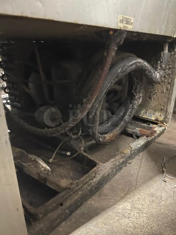 True One Door Reach In Freezer T23F showing exposed wiring and wear. Serial 13209831. Needs maintenance. 115V 1 Phase.