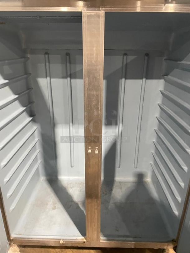 Delfield 6051-S 2 Solid Door Reach-In Cooler, 115V, on casters, interior view, clean condition.