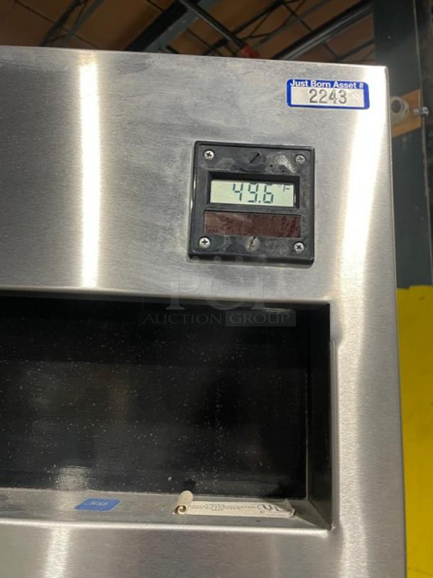 Delfield 6051-S 2-door reach-in cooler, stainless steel, digital display showing 49.6°F. Serial 340703-T, on casters.