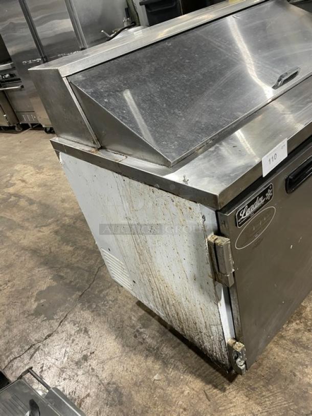 Leader 48" Mega Top Refrigerated Sandwich Prep Table, Model ESLM48S/C, visible wear, 115V, 1 Phase, on casters.