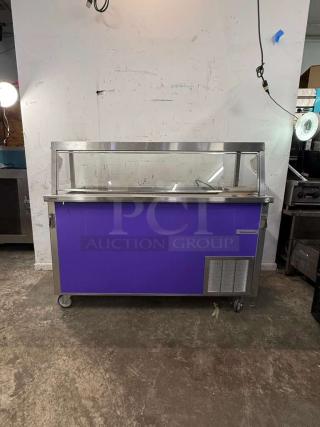 Delfield SCSC-60-EFP 60" refrigerated food serving counter, purple panel, stainless steel top, casters, visible drain.