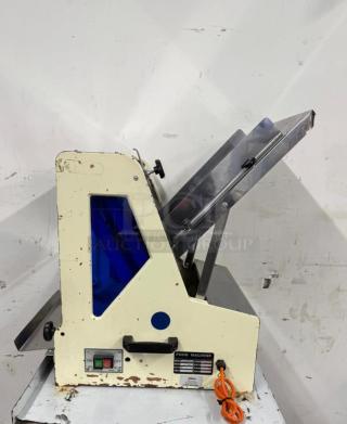 NICE Omcan USA Countertop Bread Slicer, Model 302-5/18, 1/4 HP, 110V. Worn exterior, operational dials, and power cord included.