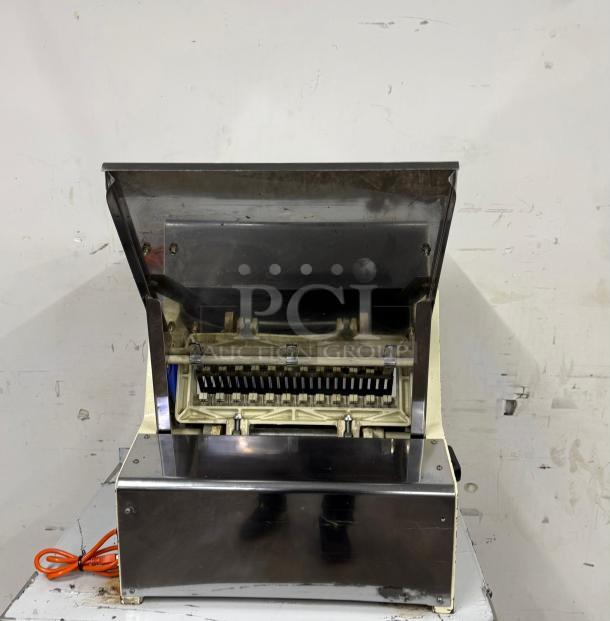 Omcan USA countertop bread slicer, 1/4 HP, 110V, model 302-5/18. Stainless steel finish, in good condition. Ideal for bakeries.