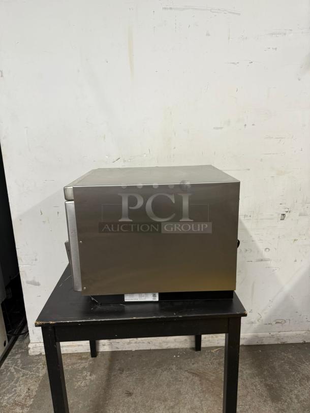 MENUMASTER RC17S2 commercial microwave, 1700 watts, stainless steel, 19" heavy volume, shown on table, used condition.