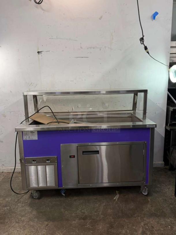Delfield SCSC-60-EFFP 60" refrigerated food serving counter with stainless steel panels and drain; condition appears used.