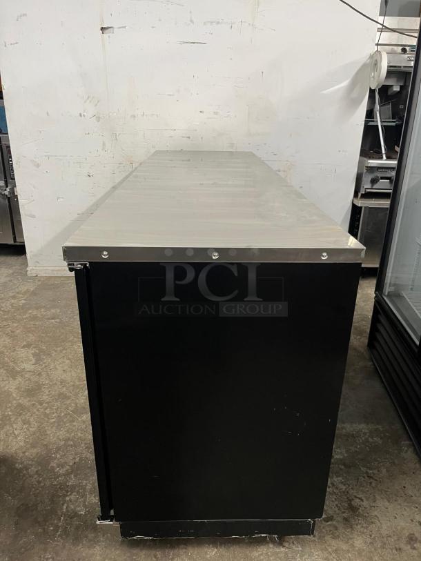 PADELA UBB-4-HC 90" back bar cooler, three-section solid doors, black exterior, stainless steel top, good condition.