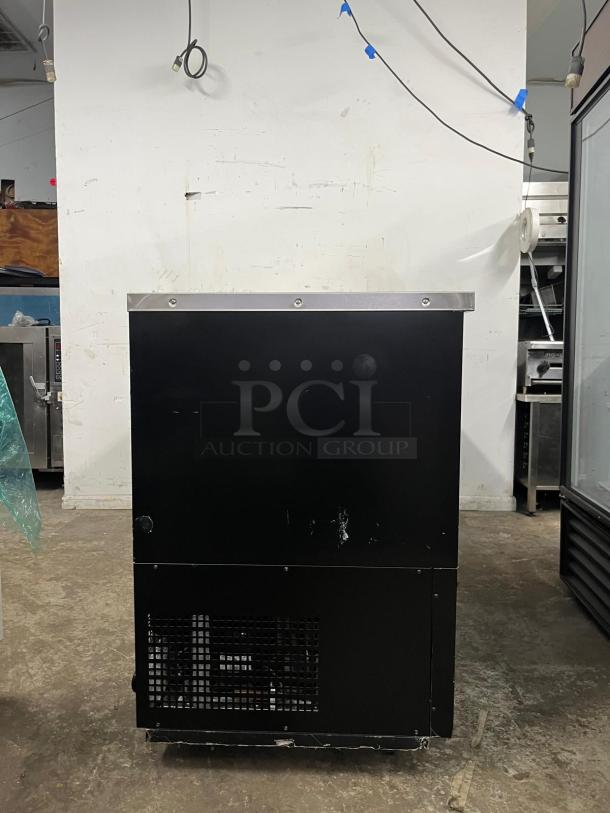 PADELA UBB-4-HC 90" 3-section solid-door back bar cooler, shows minor wear, exterior black finish, sturdy construction.