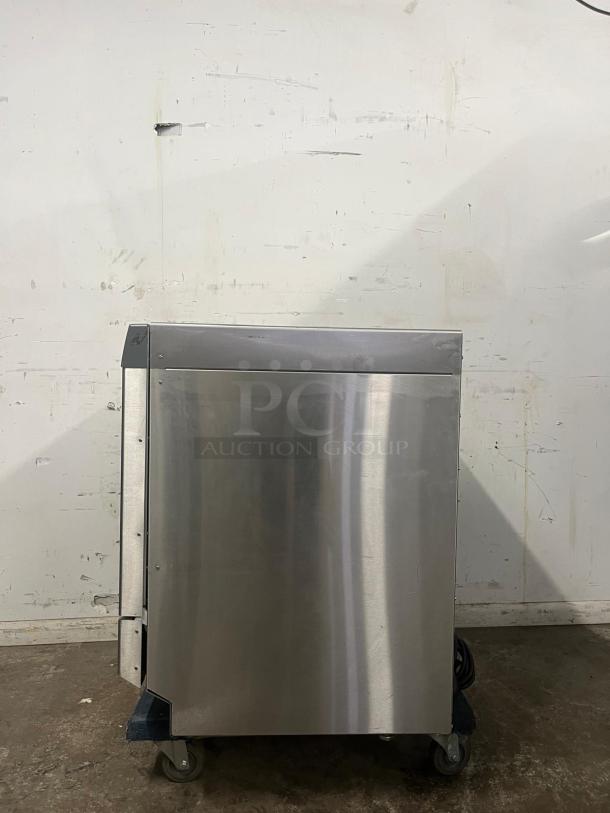 LABCONCO under counter dishwasher, stainless steel, minimal wear. Mounted on wheels for mobility. Ideal for efficient cleaning.