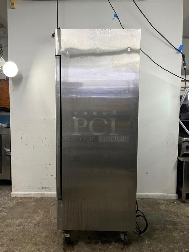 ATOSA MBF8505GR 27" stainless steel refrigerator, 19.1 cu ft, ENERGY STAR®, minor surface dents, on caster wheels.