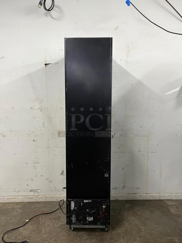 Yukon USF-175BLK commercial single glass door freezer, black, visible rear components, on wheels. Used condition.