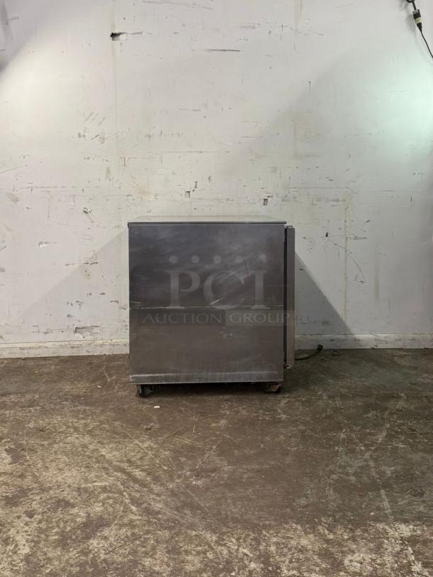 FOLLETT REV 4-ADA undercounter refrigerator, stainless steel, right hinge, moderate wear visible on exterior surface.