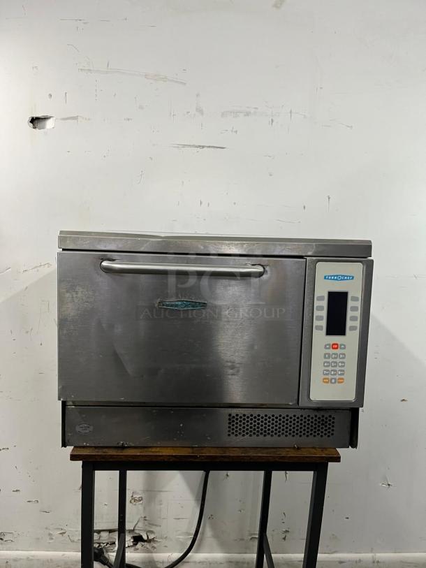 TurboChef Tornado NGC rapid cook oven, stainless steel, commercial-grade, visible control panel, fair condition, minor wear.