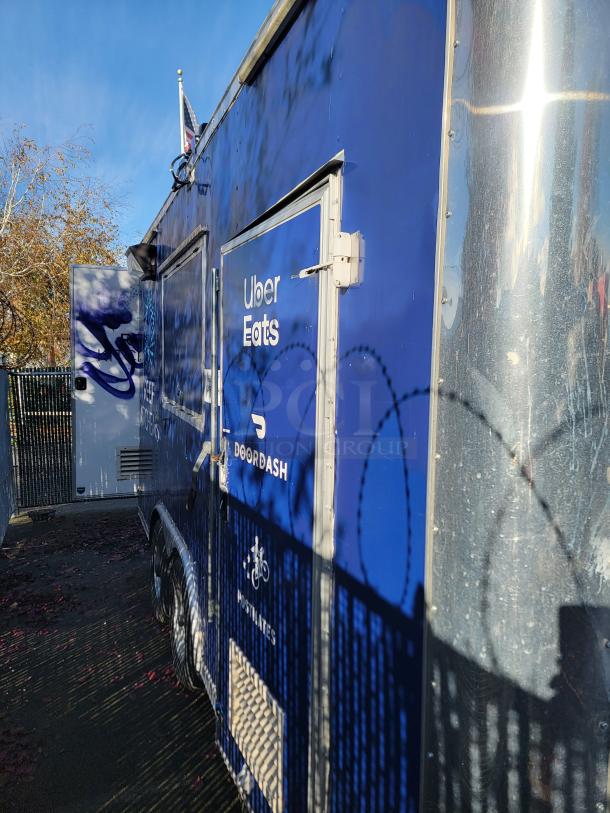 2020 Diamond Cargo 16' food trailer, blue with logos, turnkey kitchen, equipped with commercial-grade refrigeration and Wells cooking surface.