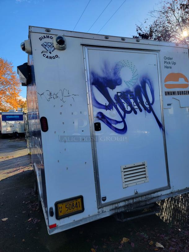 2020 Diamond Cargo food trailer with turnkey kitchen. Features commercial-grade equipment, graffiti on the side. Oregon plate.