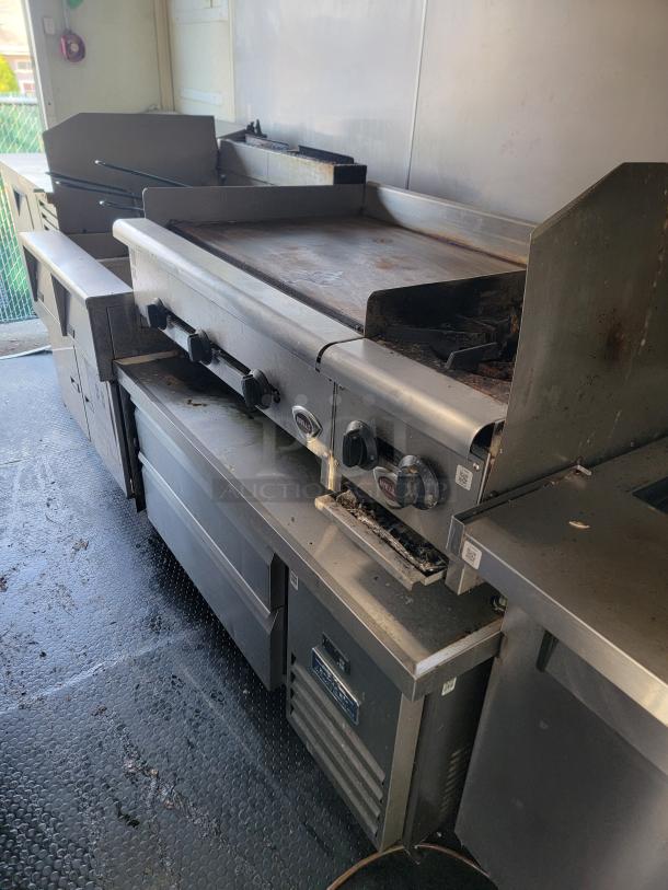 2020 Diamond Cargo food trailer interior, featuring Wells cooking surface and commercial-grade refrigeration.