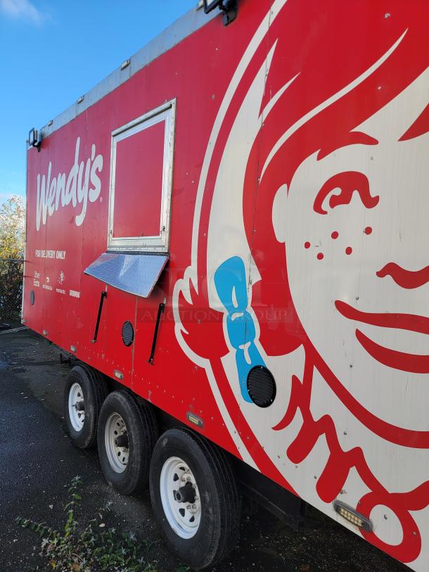 2021 28' Texino Food Trailer, red with Wendy's branding, fully equipped kitchen, three axles, excellent condition.