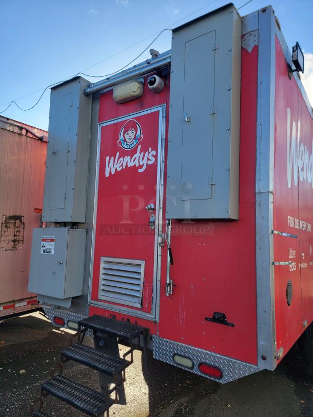 2021 28' Texino Food Trailer with Wendy's branding, stair access, roof vent, and electrical panel; ready for high-volume cooking.