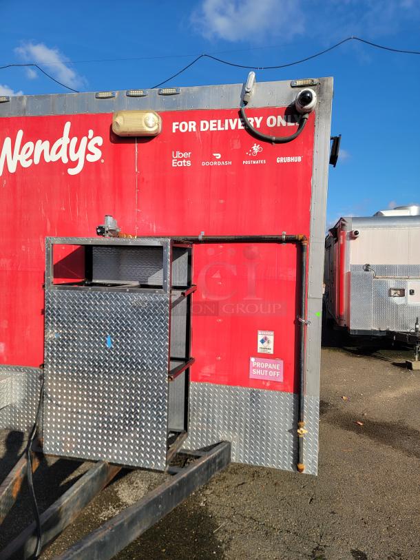 2021 Texino 28' food trailer with delivery branding, robust build, and propane shut-off label, ideal for mobile food business.