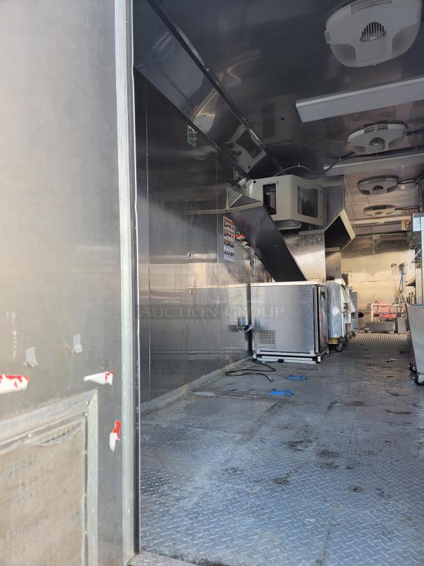 2021 Texino 28' Food Trailer interior with stainless steel equipment, CaptiveAire exhaust, Turbo Air, and Hoshizaki units.
