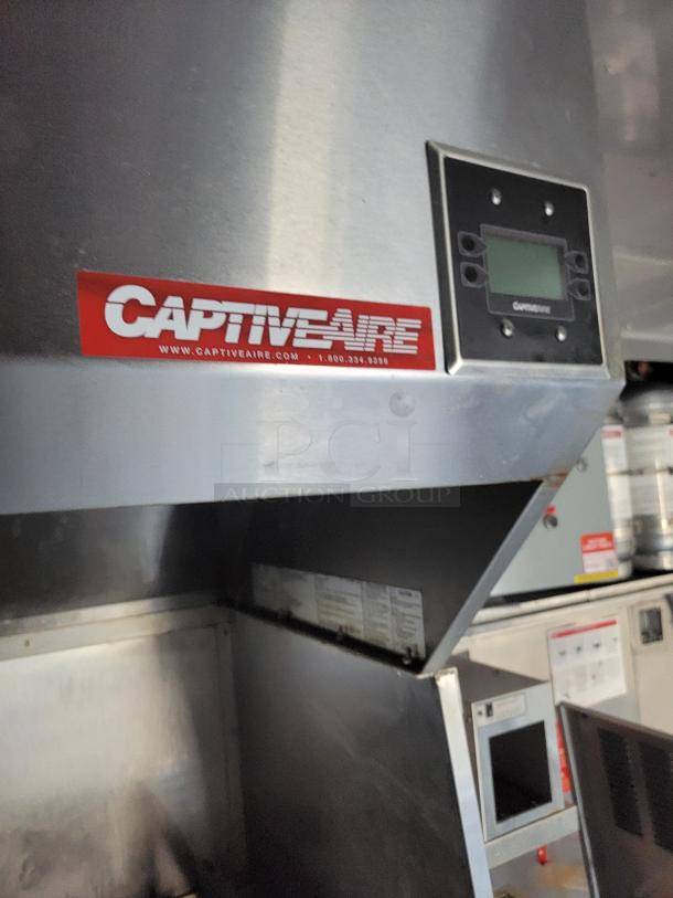CaptiveAire exhaust hood in 2021 Texino food trailer, featuring digital controls for high-volume commercial cooking.